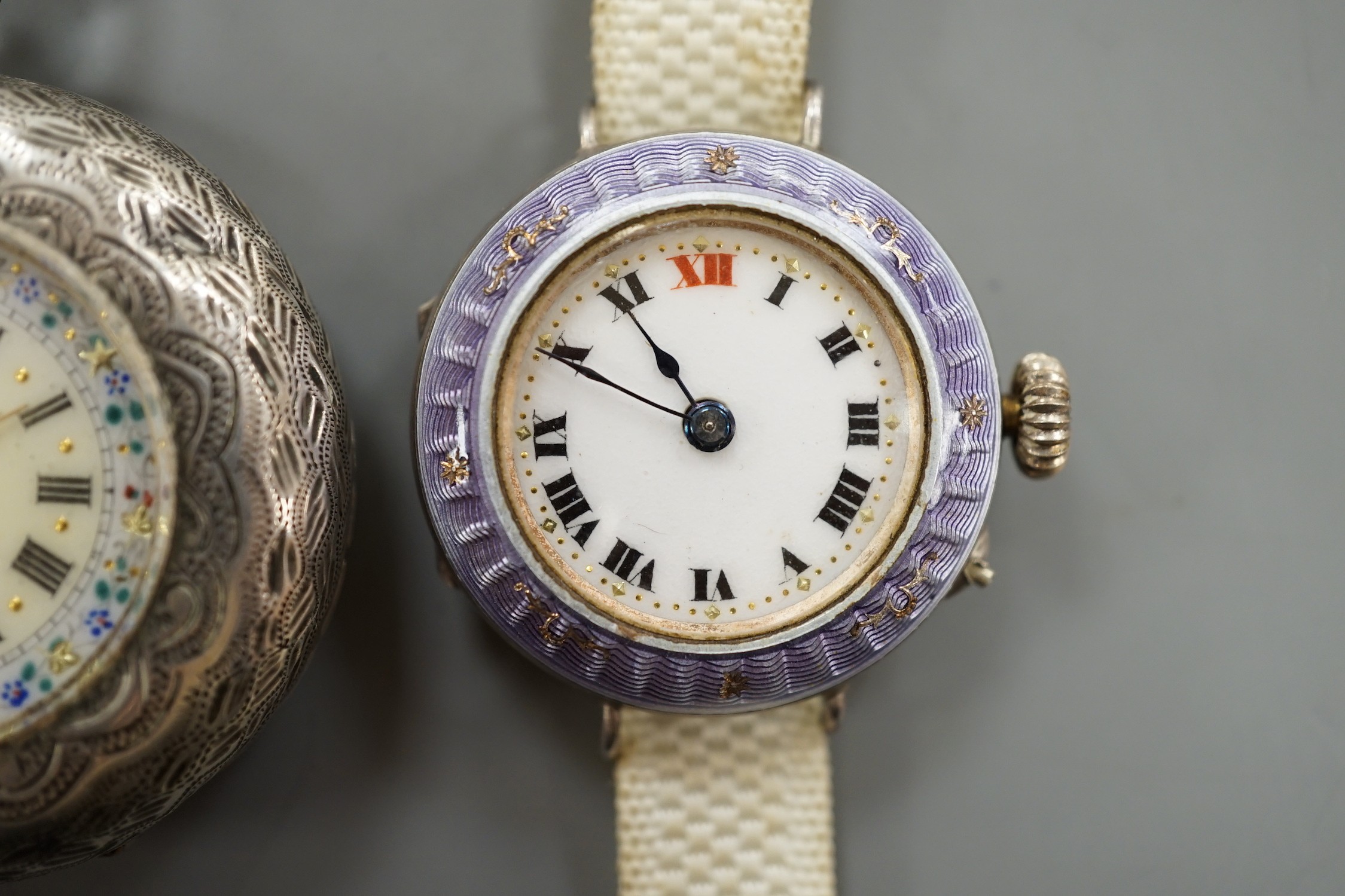 A lady's early 20th century silver and enamel manual wind wrist watch and an 800 standard white metal fob watch.